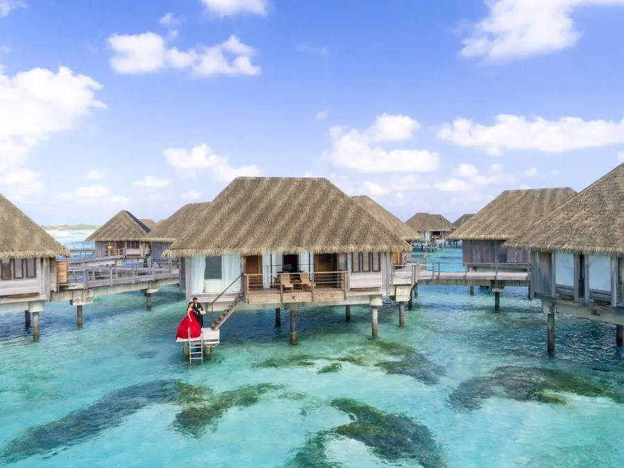 Overwater villas above a turquoise lagoon in the Maldives