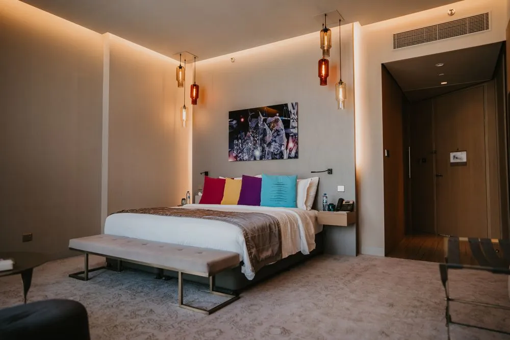 Elegant hotel bedroom with warm lighting