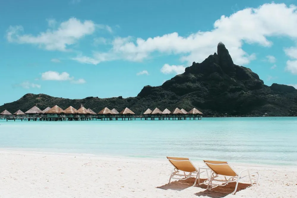 Overwater bungalows beneath Mount Otemanu in Bora Bora