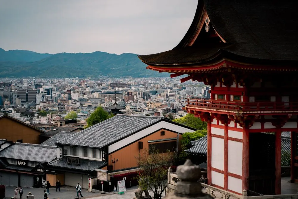 Red pagoda overlooking the rooftops of Kyoto