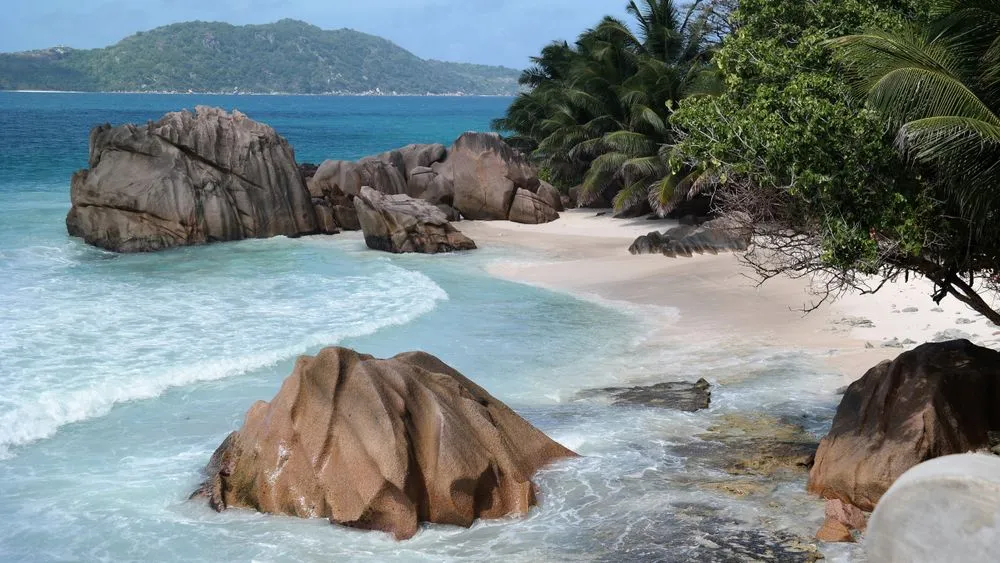 Granite boulders on a white sand beach in the Seychelles